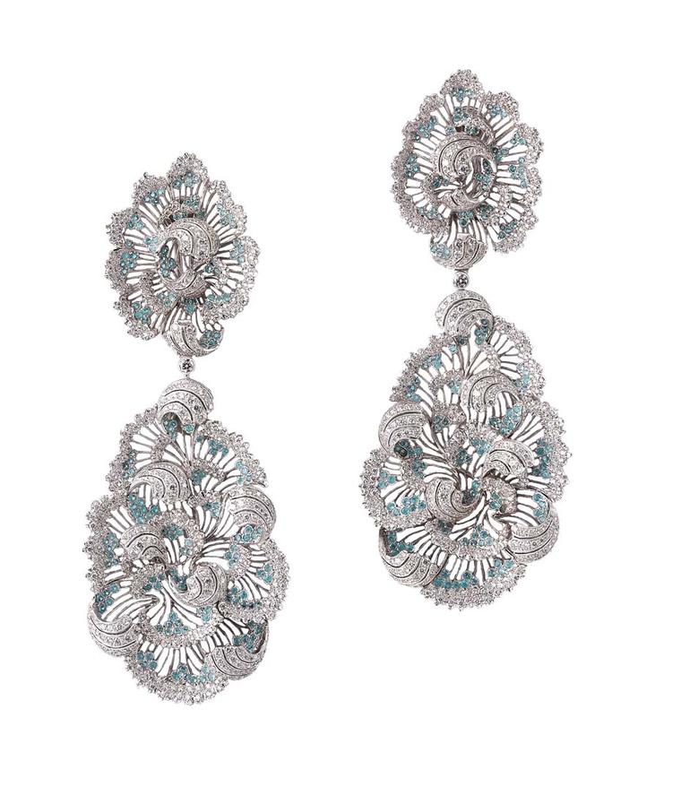 The complex design of Buccellati's white gold pendant earrings stays true to its enchanting style, infusing elegant curls with 1,066 round brilliant-cut diamonds and 354 Paraíba tourmalines.